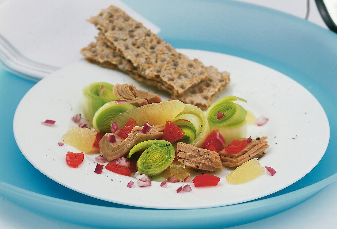 Leek salad with tuna and tomatoes on plate