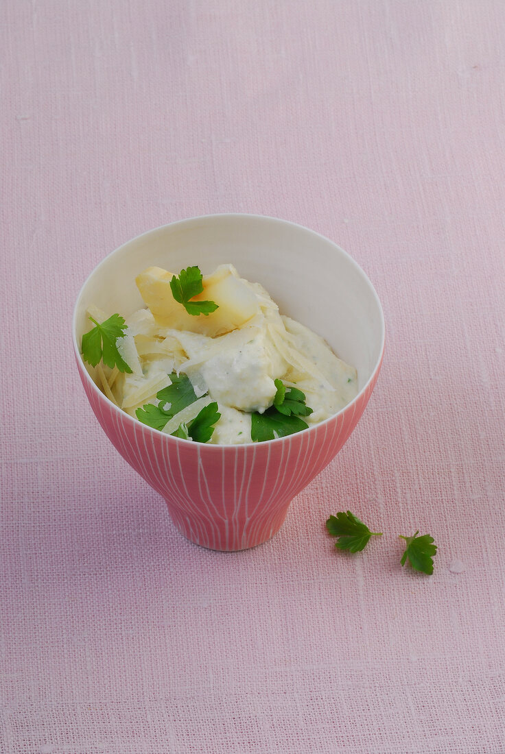 Artichoke dip with parmesan in bowl