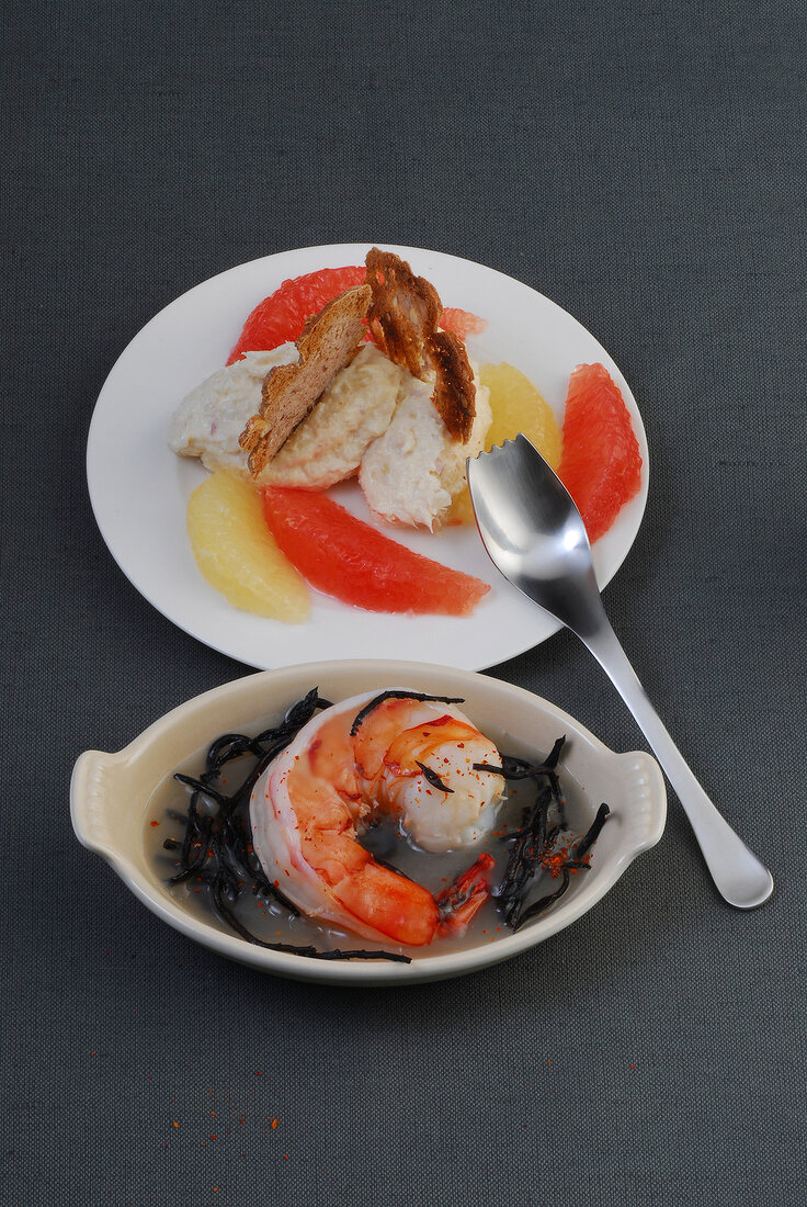 Trout mousse on plate and bowl of shrimp in jelly