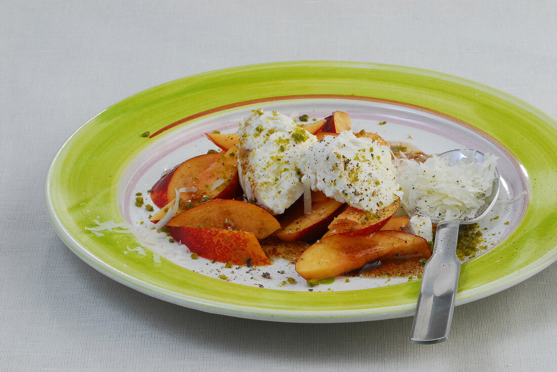 Nectarines with fresh goat cheese on plate