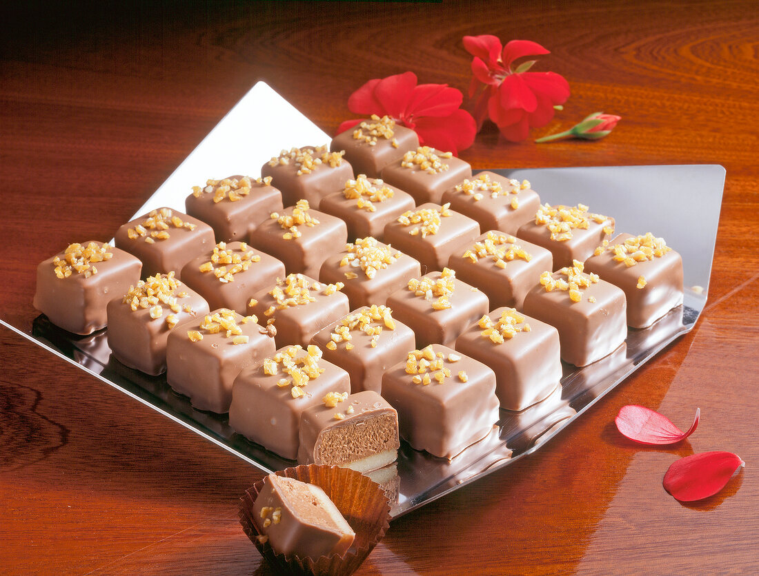 Amaretto truffle cubes in serving dish with red flower