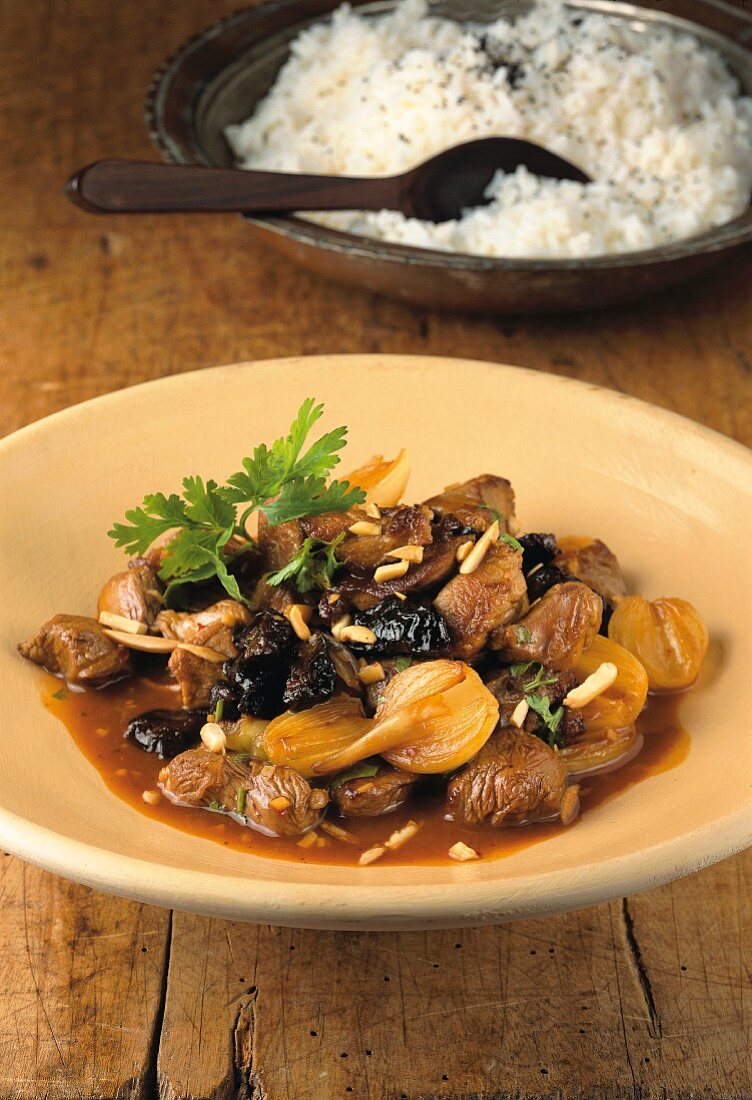 Andalusian–Chinese plum lamb with almonds and pearl onions