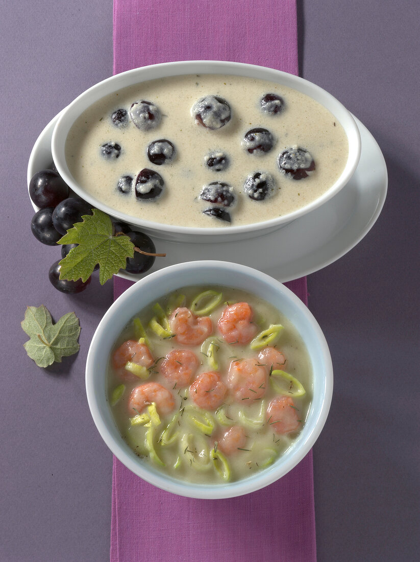 Celery cream and grapes, potato and leek sauce in bowls
