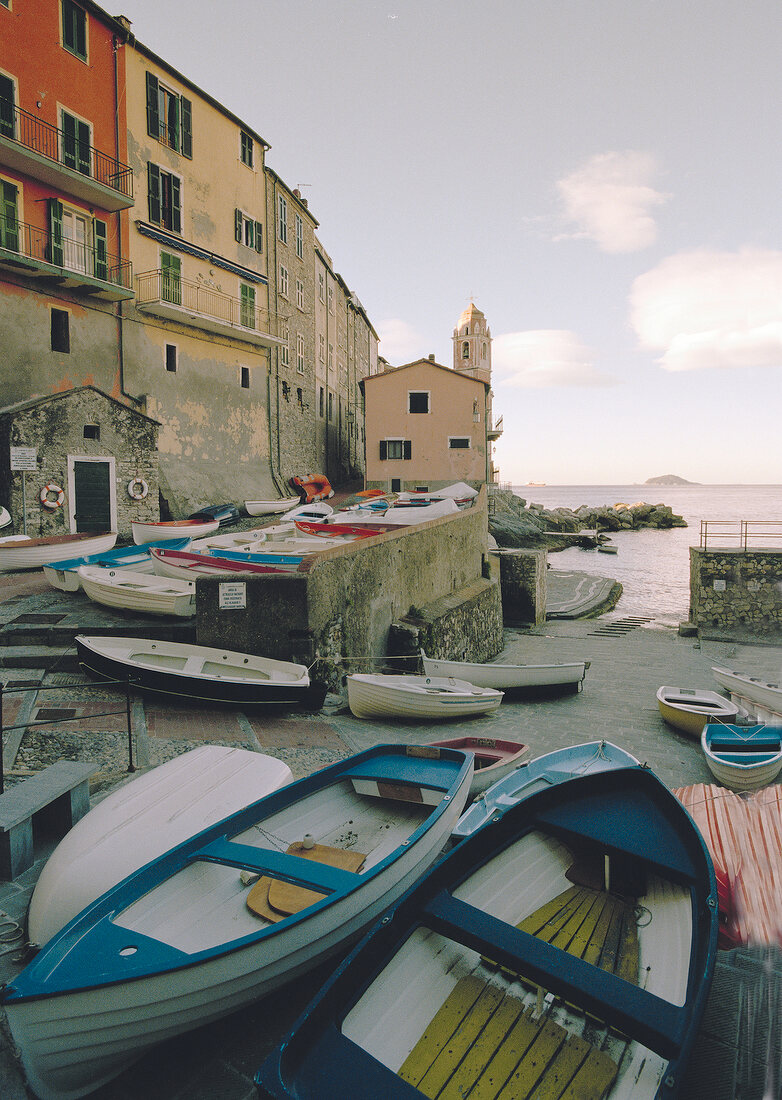 View of houses and fishing boats in Tellaro at Riviera di Levante, Italy