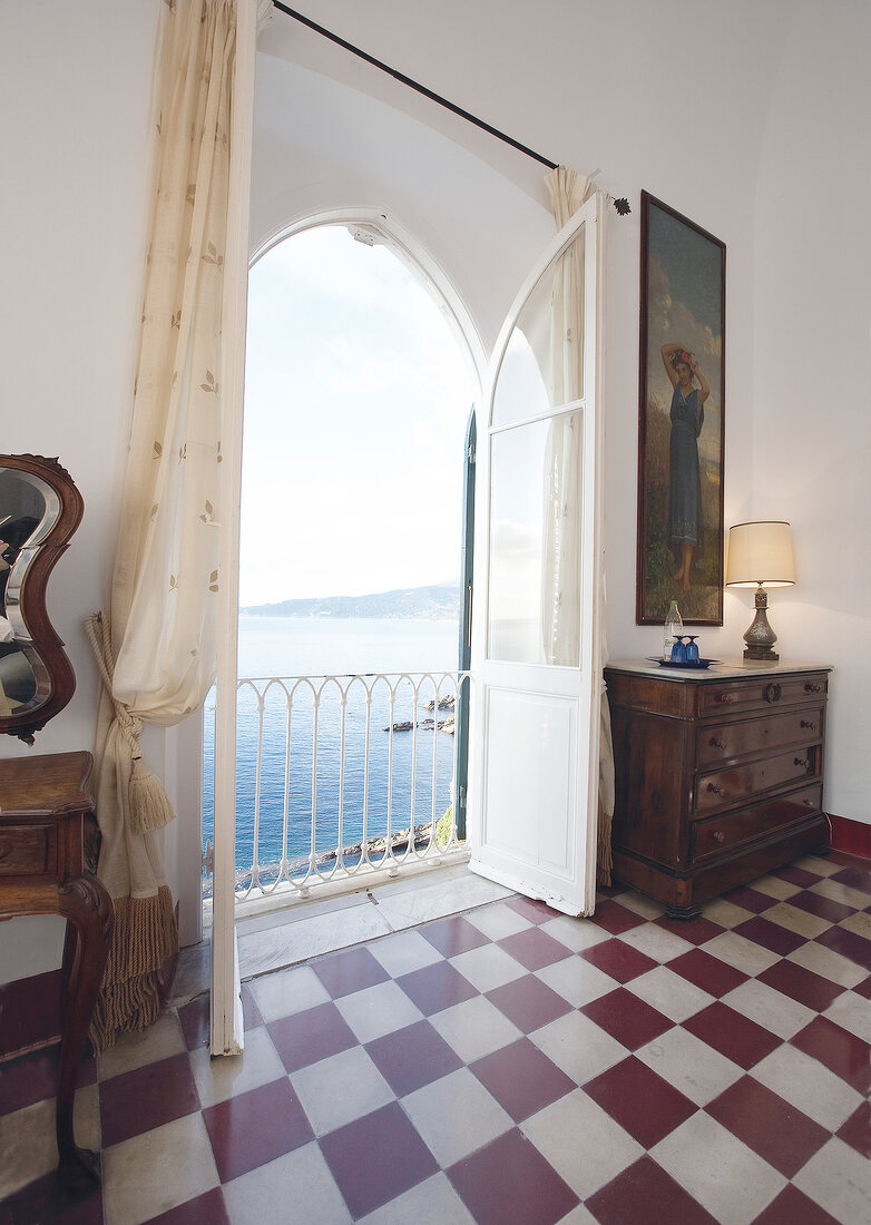 View of window and checked tiled floor in Hotel Castello Canevaro at Cinque Terre, Italy