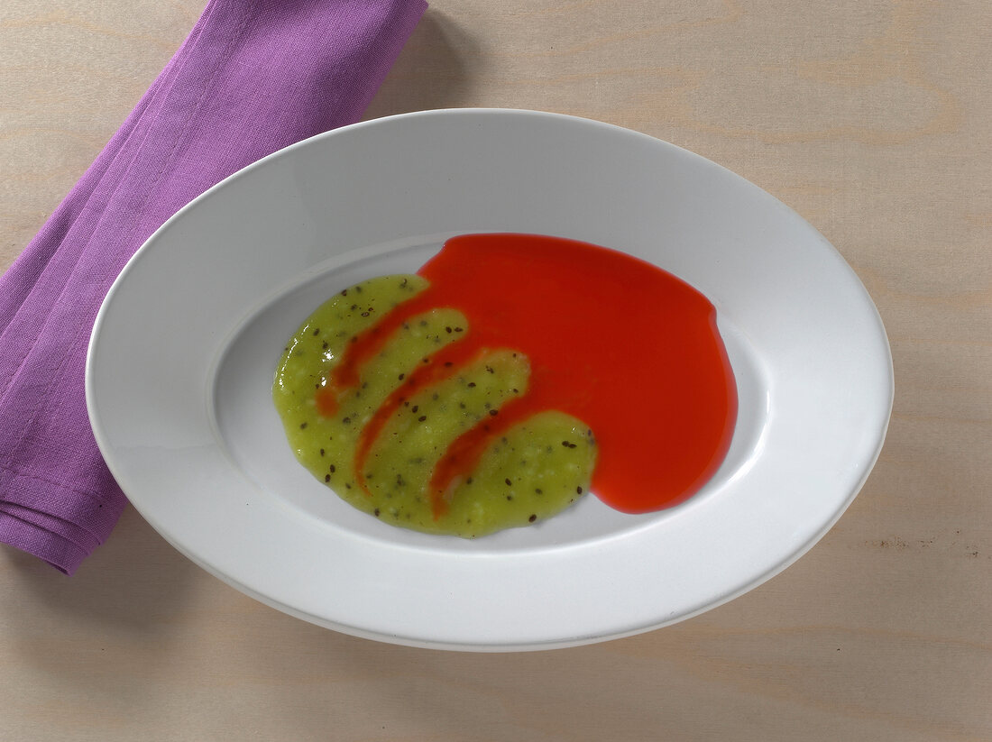 Kiwi and raspberry duet on plate 