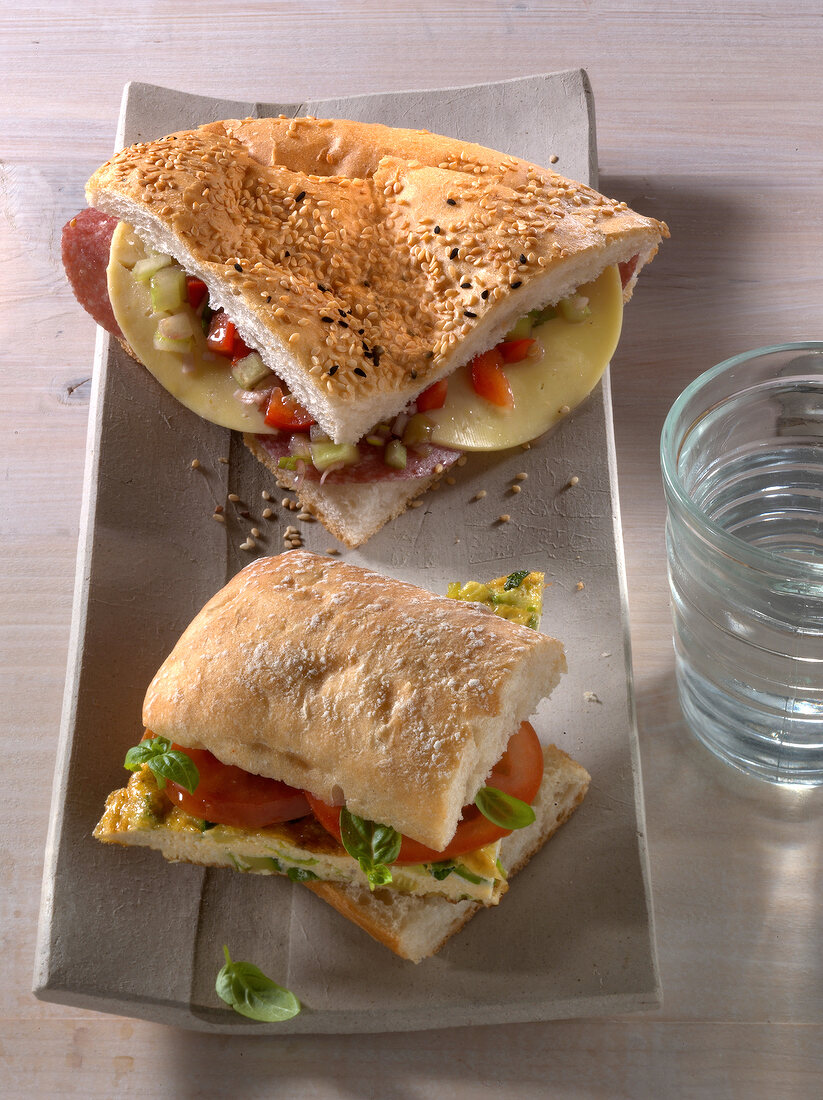 Ham and cheese flatbread and ciabatta with zucchini frittata on tray