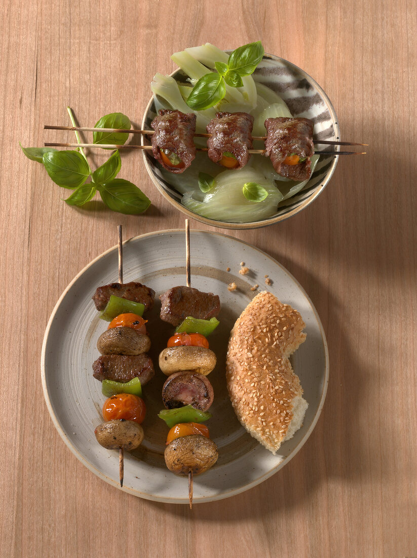 Lamb shish kebab and sesame bread with beef skewer on fennel