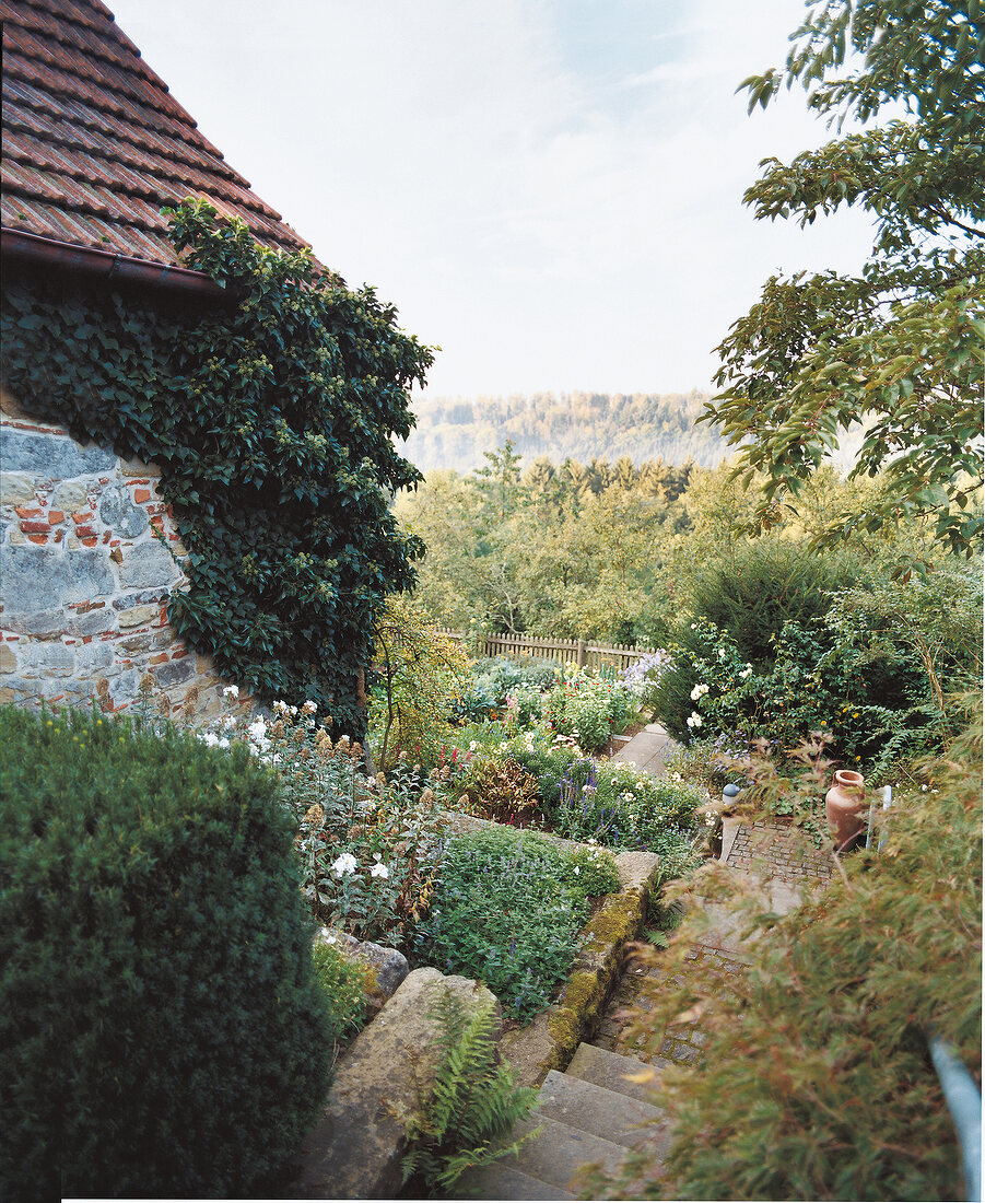 View of monastery garden with plants cascade