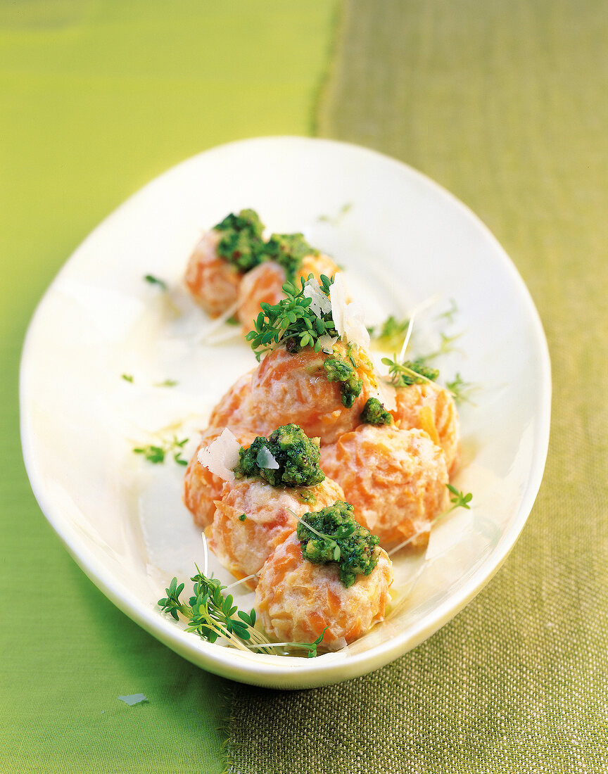 Carrots and ricotta knodelinos with watercress pesto in serving dish