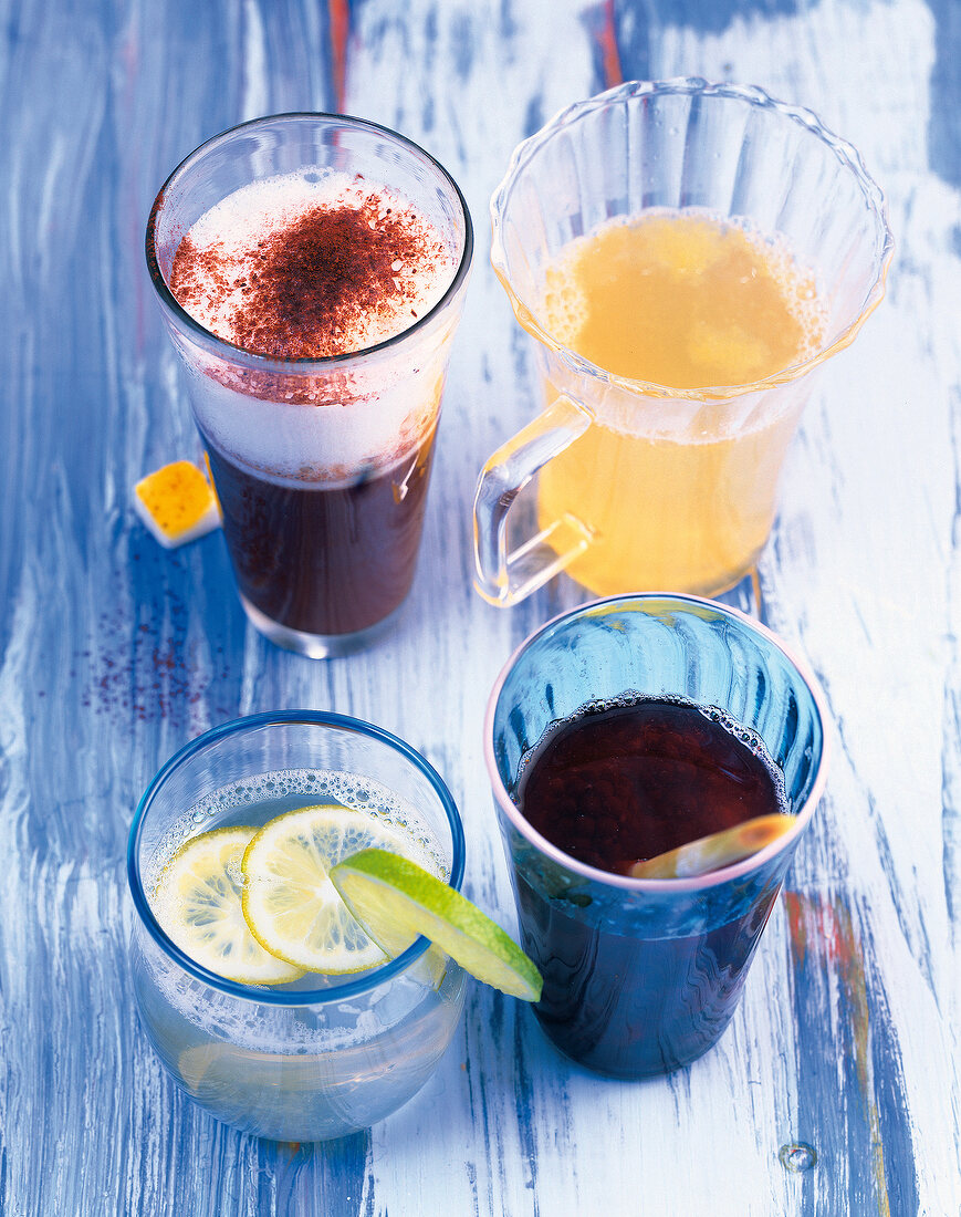 Four different drinks in glasses