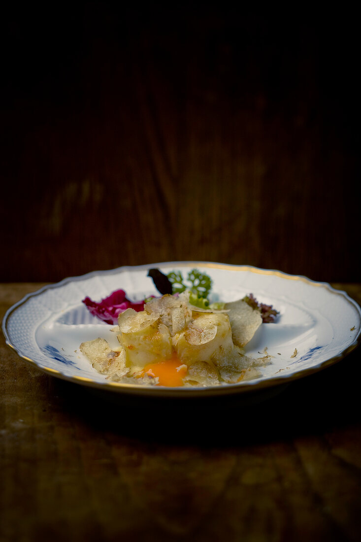 Salad of stuffed potato with alba truffle on plate