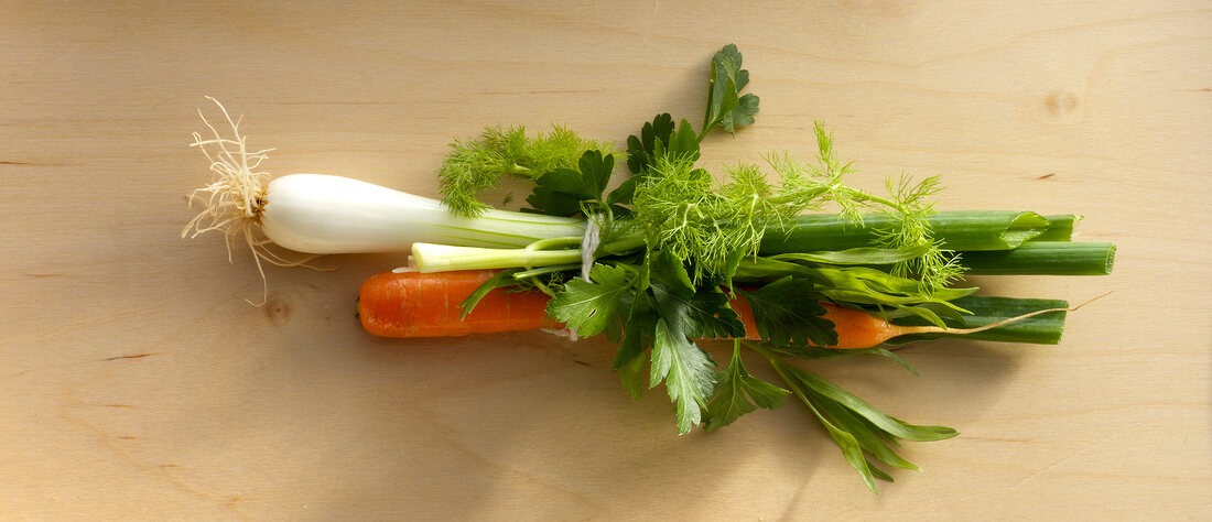 Bunch of vegetables and herbs for preparation of chicken, overhead view