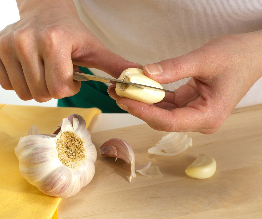 Garlic being cut, step 2