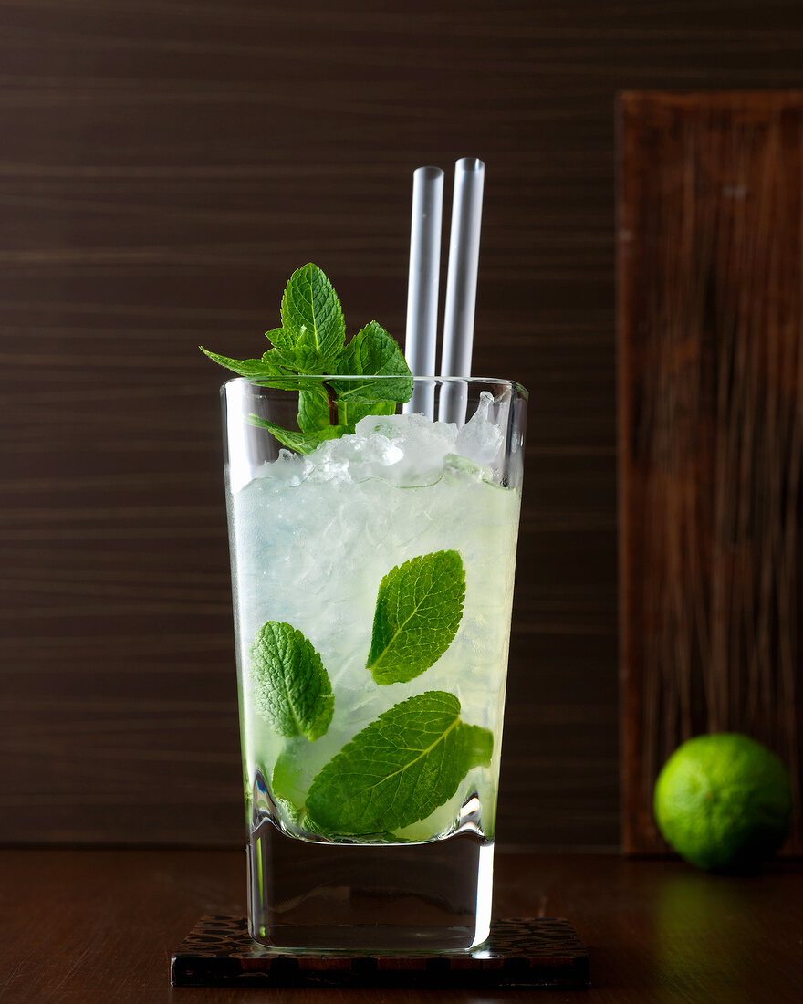 Classic Mojito with rum, lime, mint, ice and straws