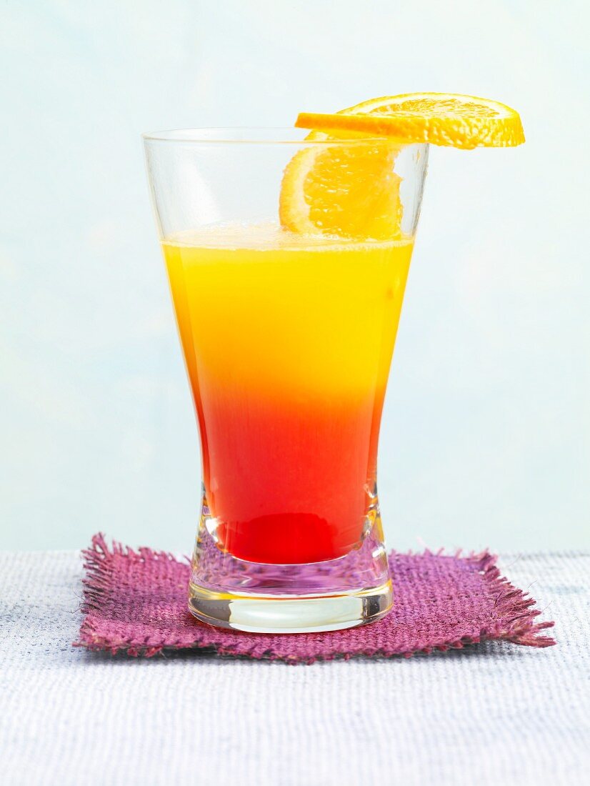 Tequila Winter Sun garnished with a slice of orange