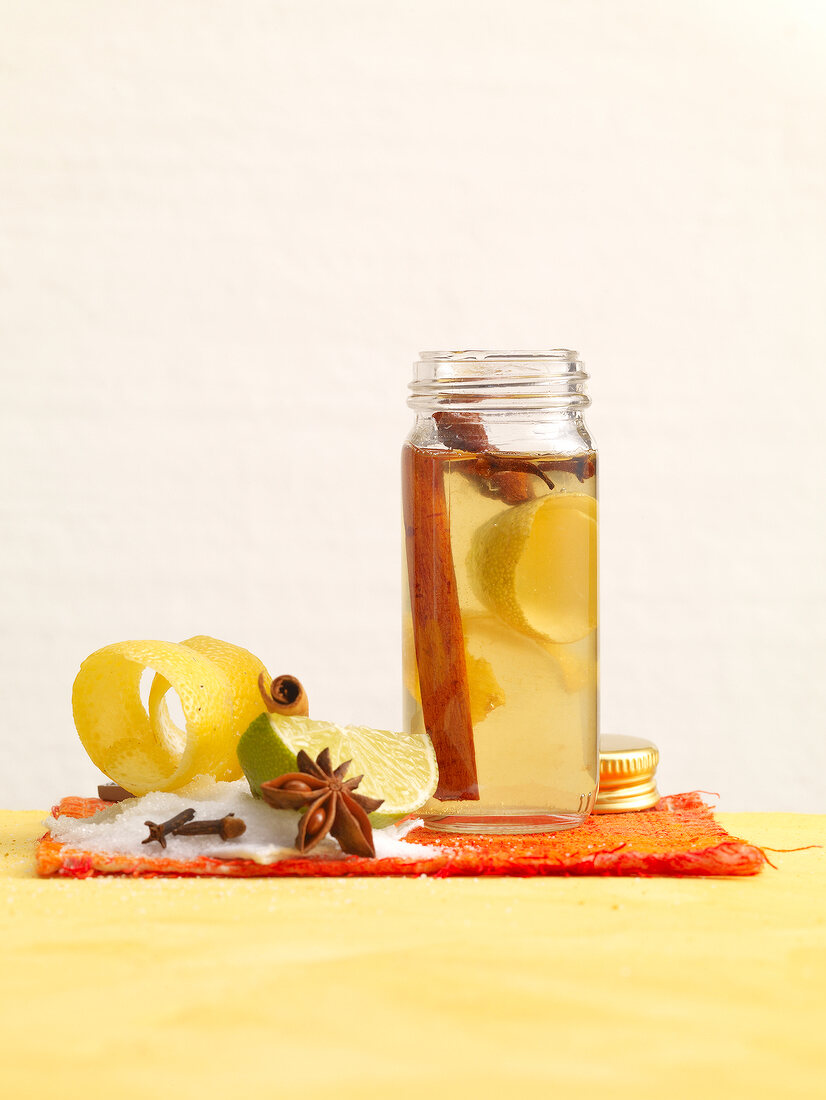 Citrus spice syrup with lime, star anise and cinnamon in jar