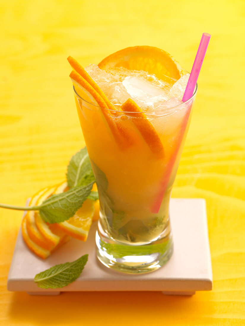 Mississippi melody with orange, mint and ice cubes in glass