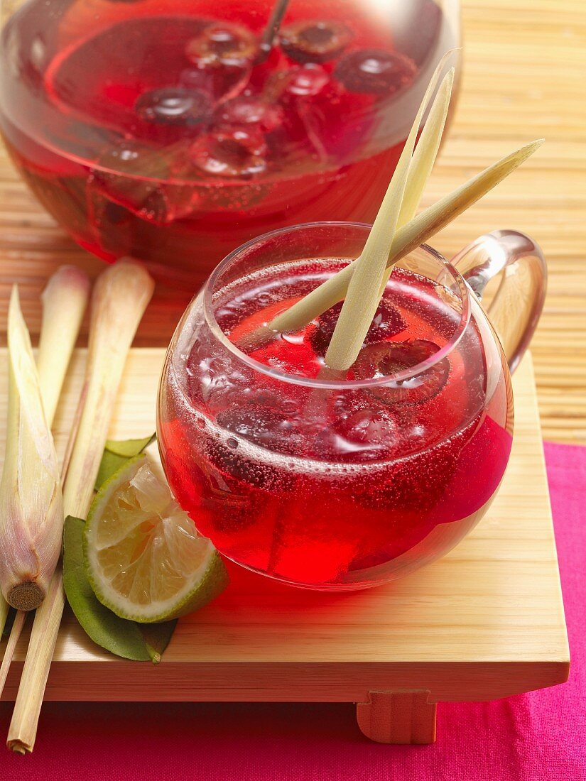 Singapore sling punch with gin, sweet cherries and lemongrass