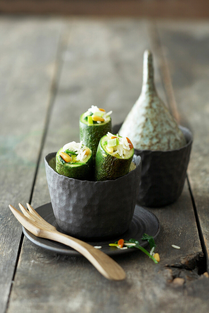 Zucchini with rice stuffing in metal bowl