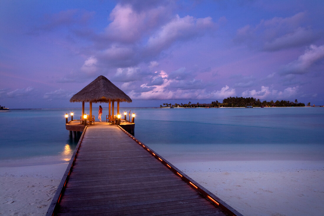 View of gazebo on jetty at sunset in Dhigufinolhu island, Maldives