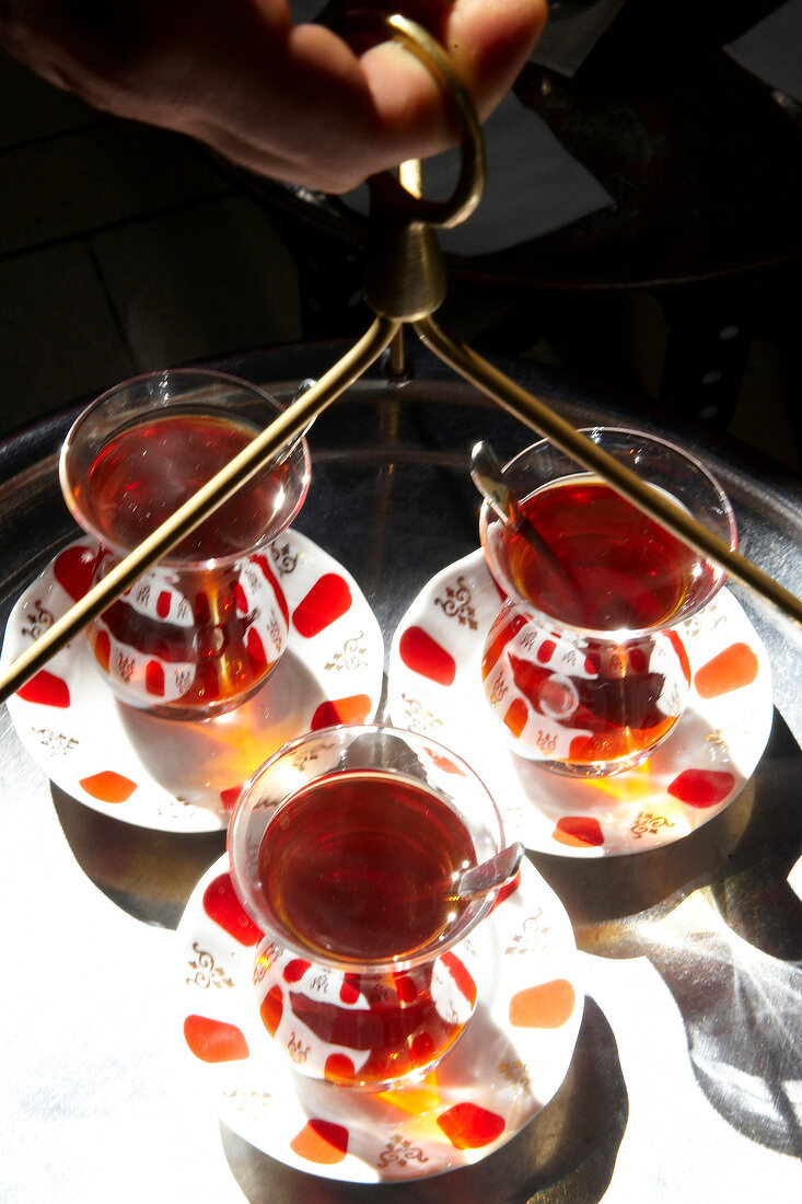 Three glasses of tea on tray