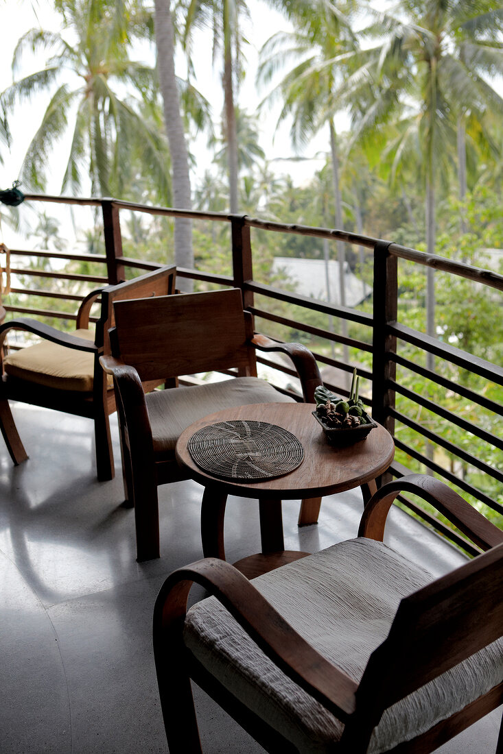 Balcony with wooden furniture in Thailand