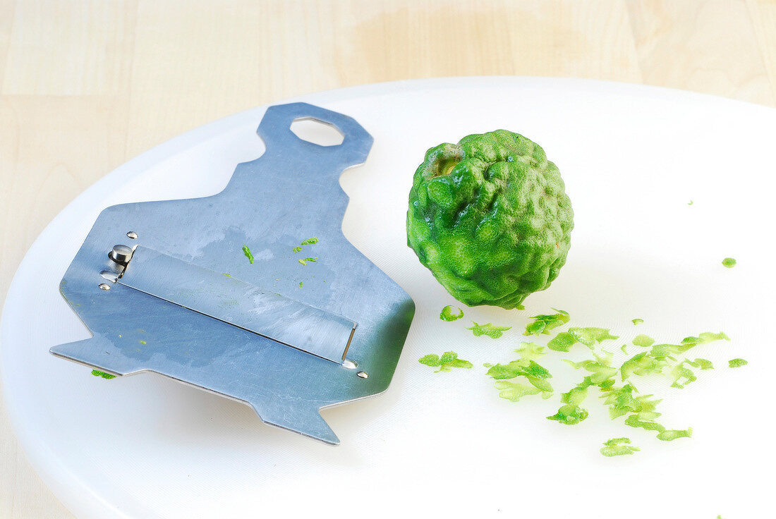 Kaffir lime with shell cutter on plate