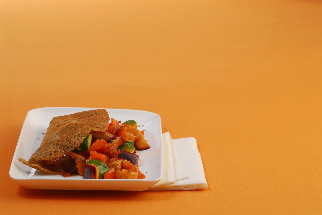 Galettes with ratatouille in serving dish