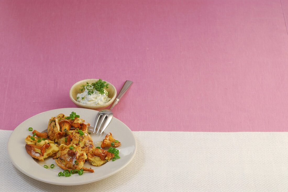 Schmarren with chanterelles on plate