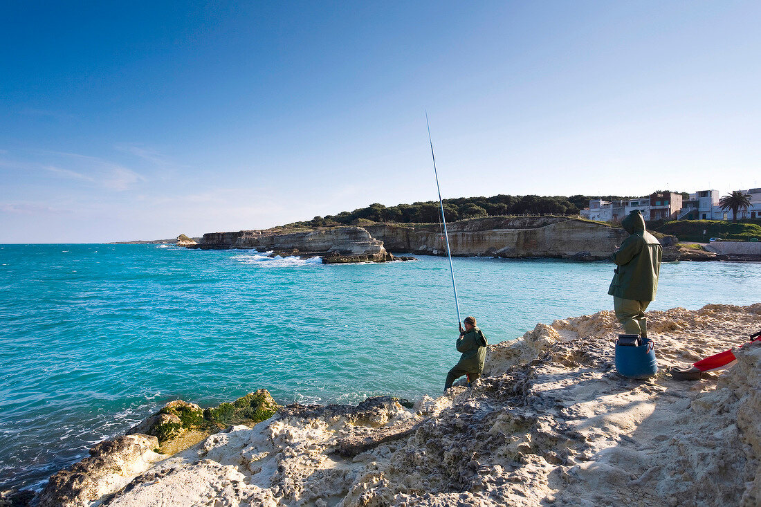 Man fishing in Torre dell 'Orso, Apulia, Italy