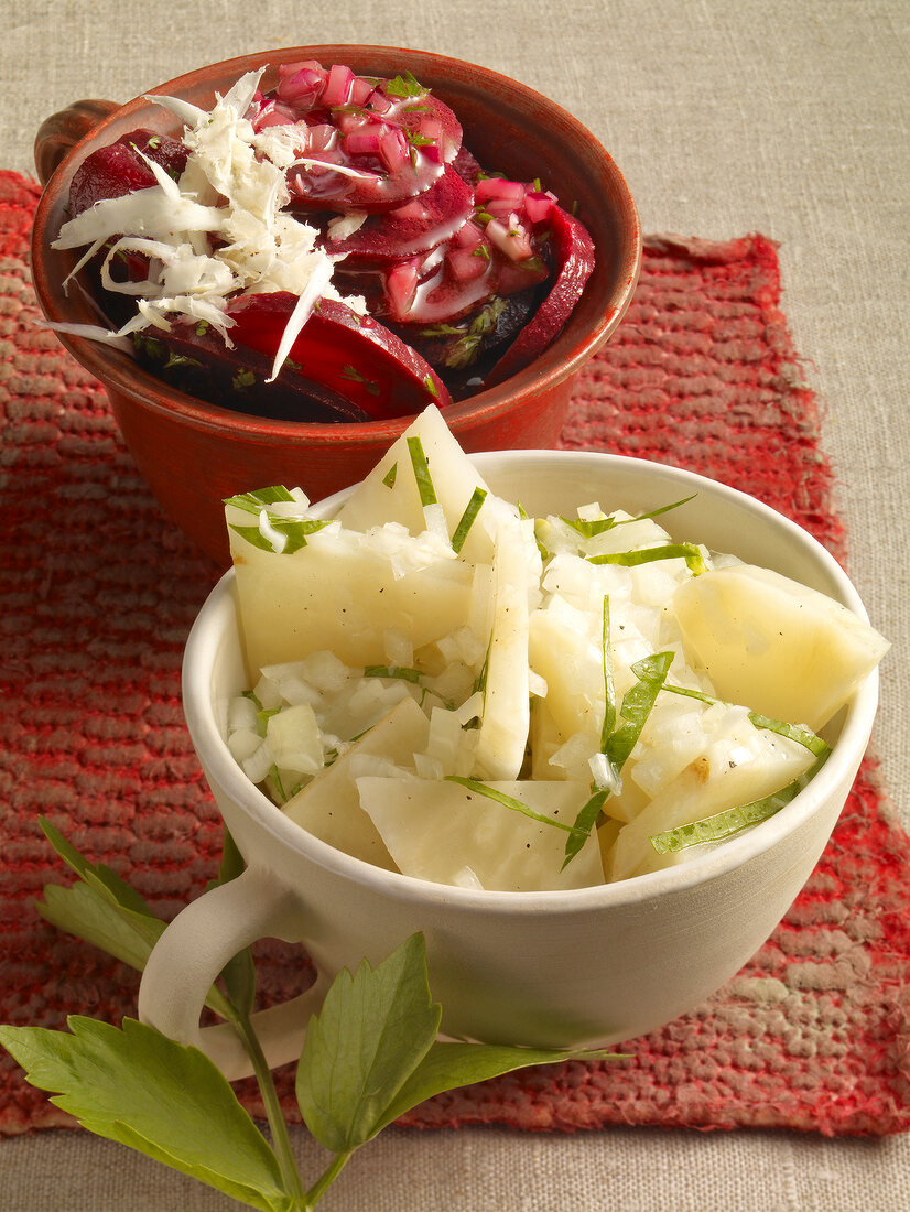 Salad with horseradish, celery and beetroot in cup bowl