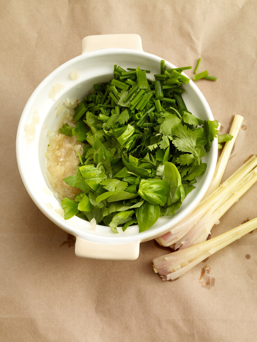 Green herbs, lemon grass and herbs in bowl