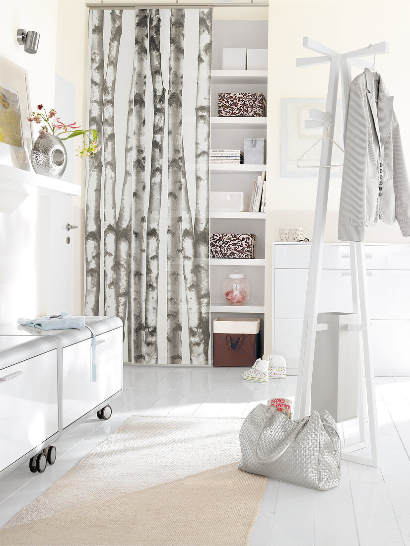 View of hallway with white furniture and wardrobe