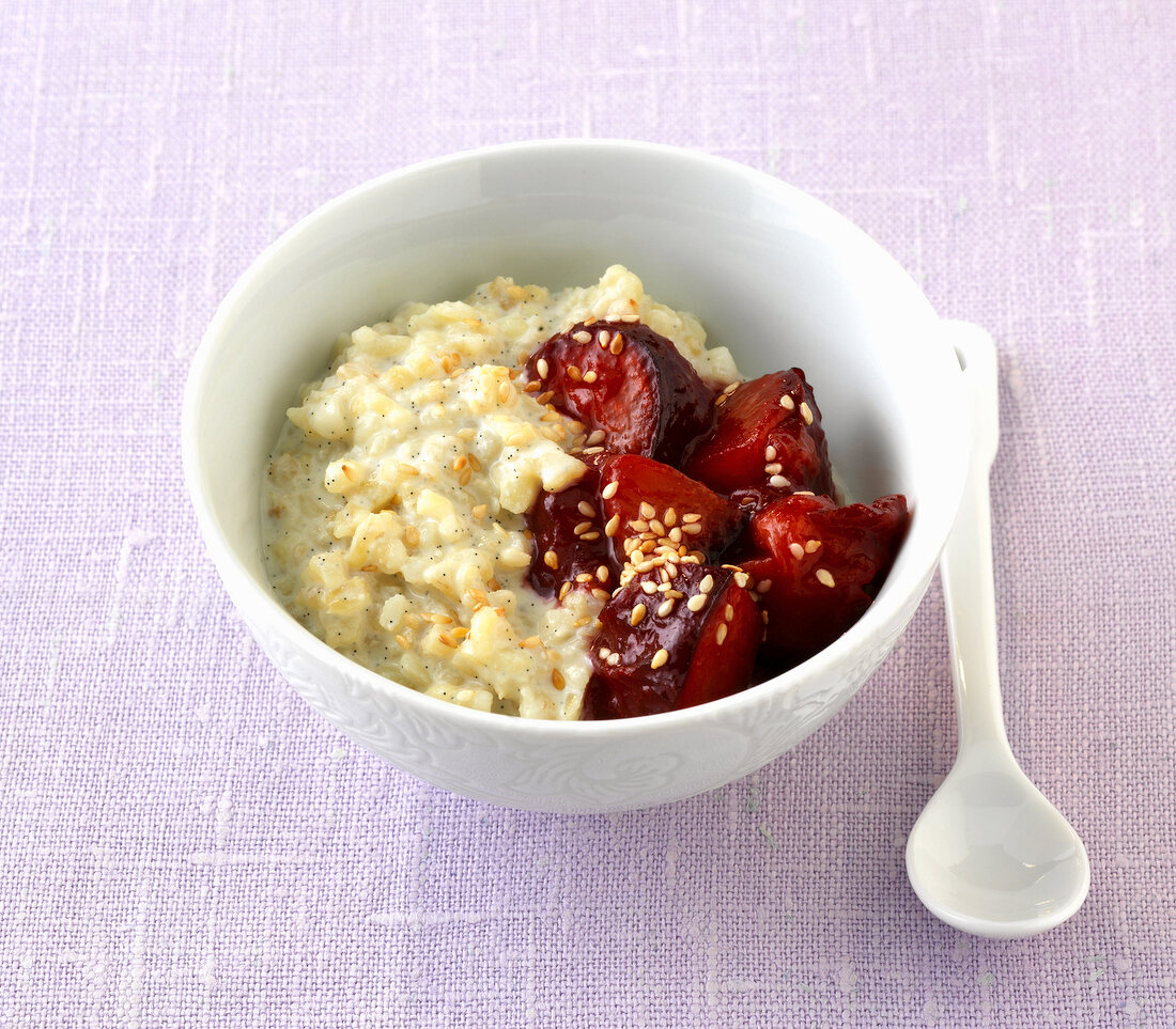Crushed bulgur with plums pieces in bowl