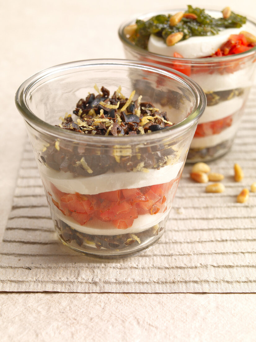 Caprese with pesto and lemon peel in glass