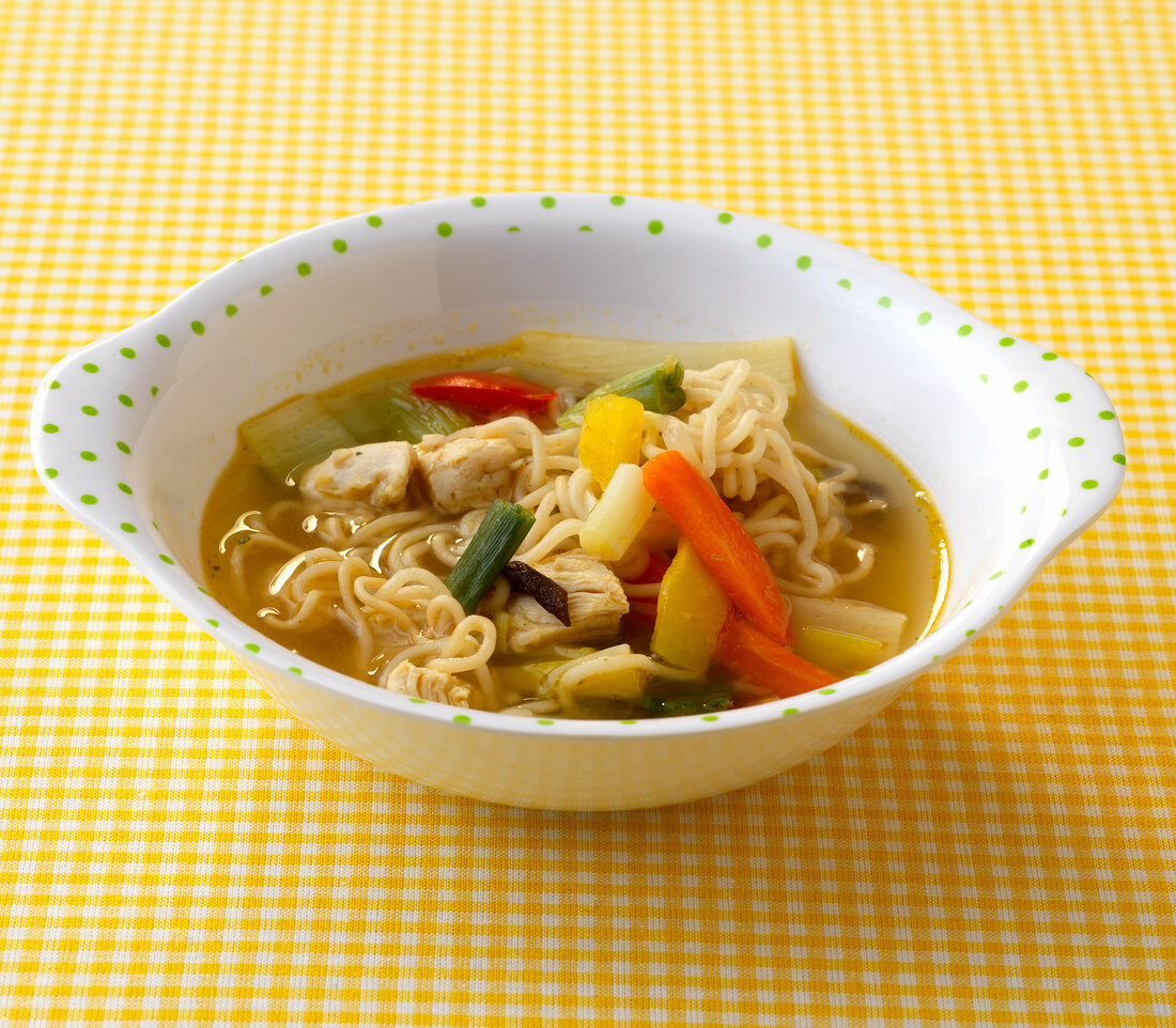Bowl of china noodle soup with vegetables