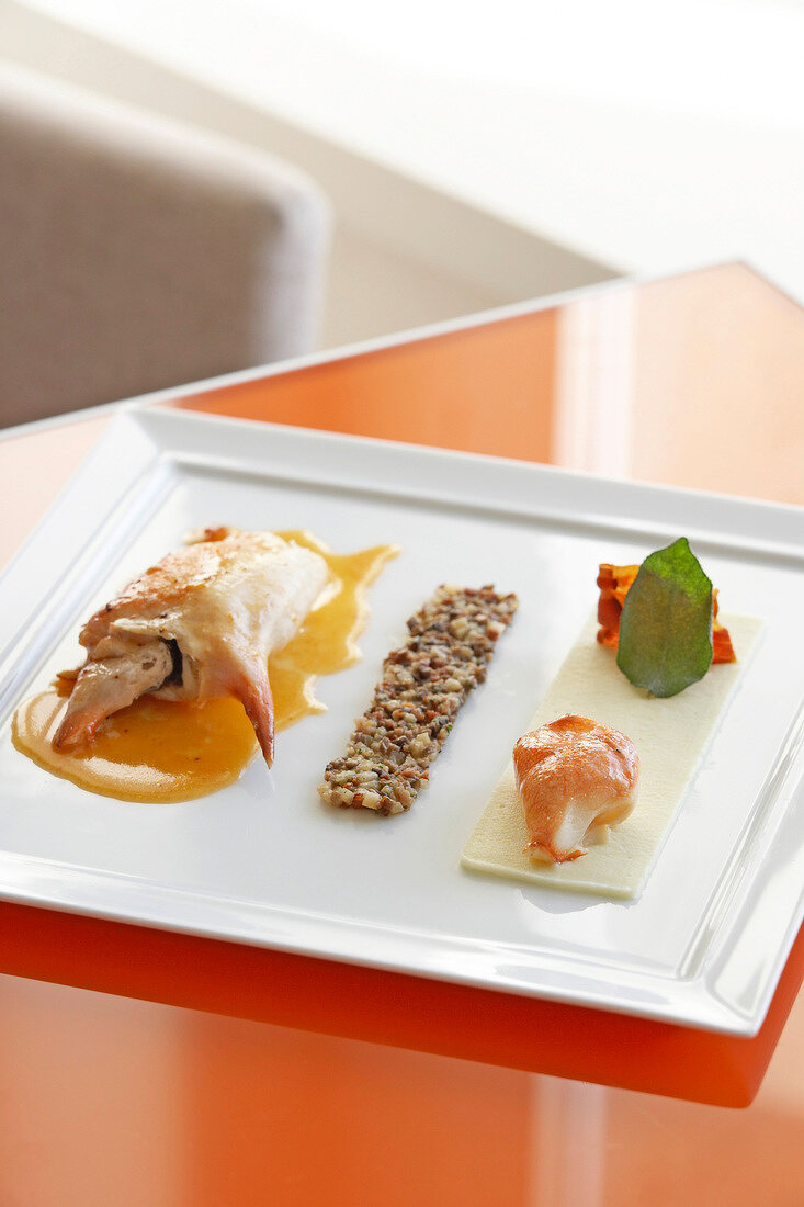 Crab with salted biscuits and vegetable puree on serving plate