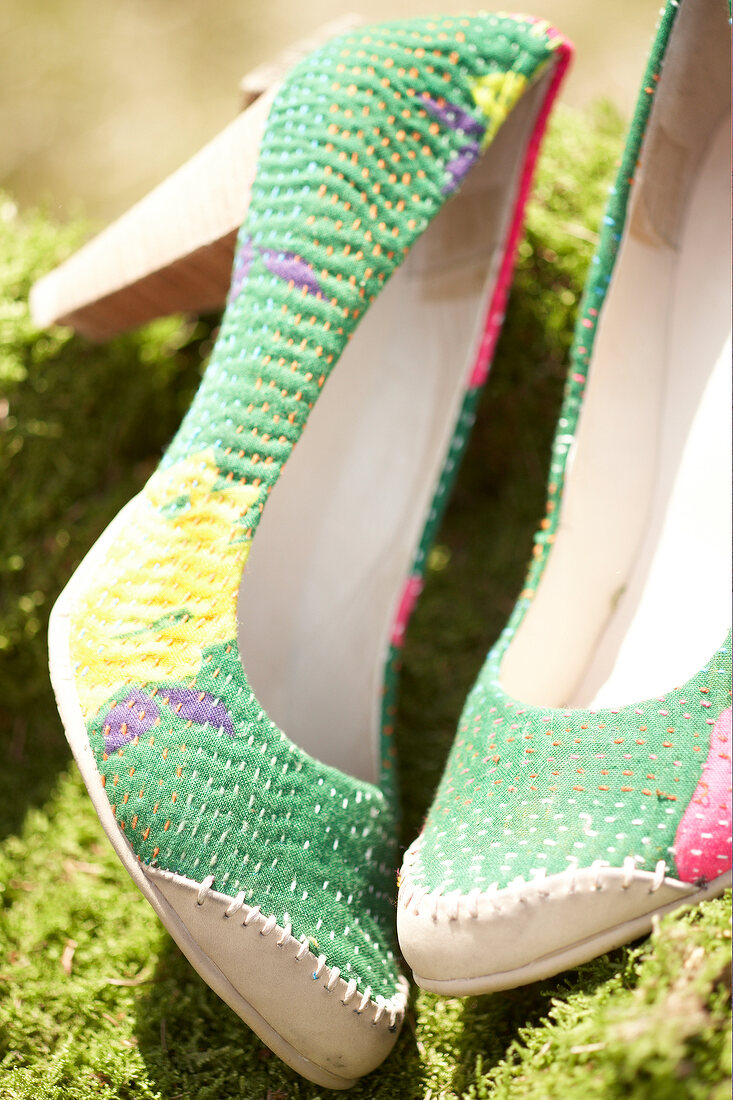 Close-up of pair of green pumps made of recycled cotton