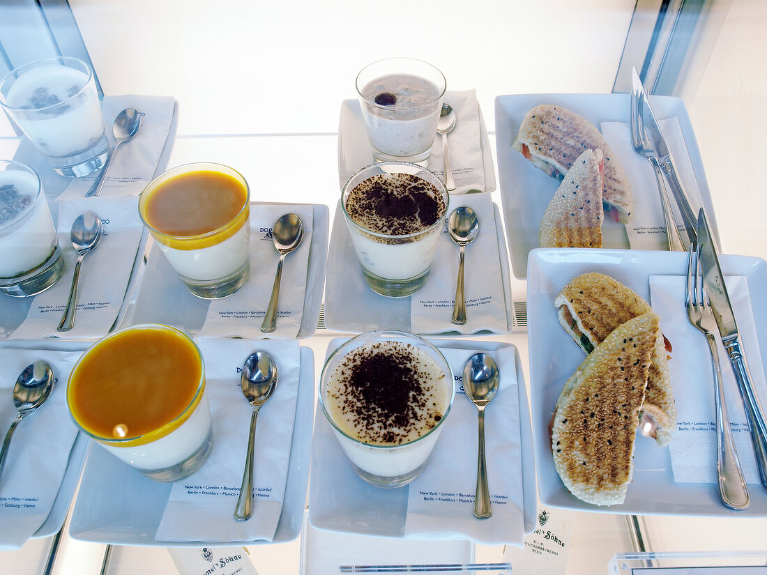 Laid table with coffee, tea and bread in BMW World, Munich, Germany