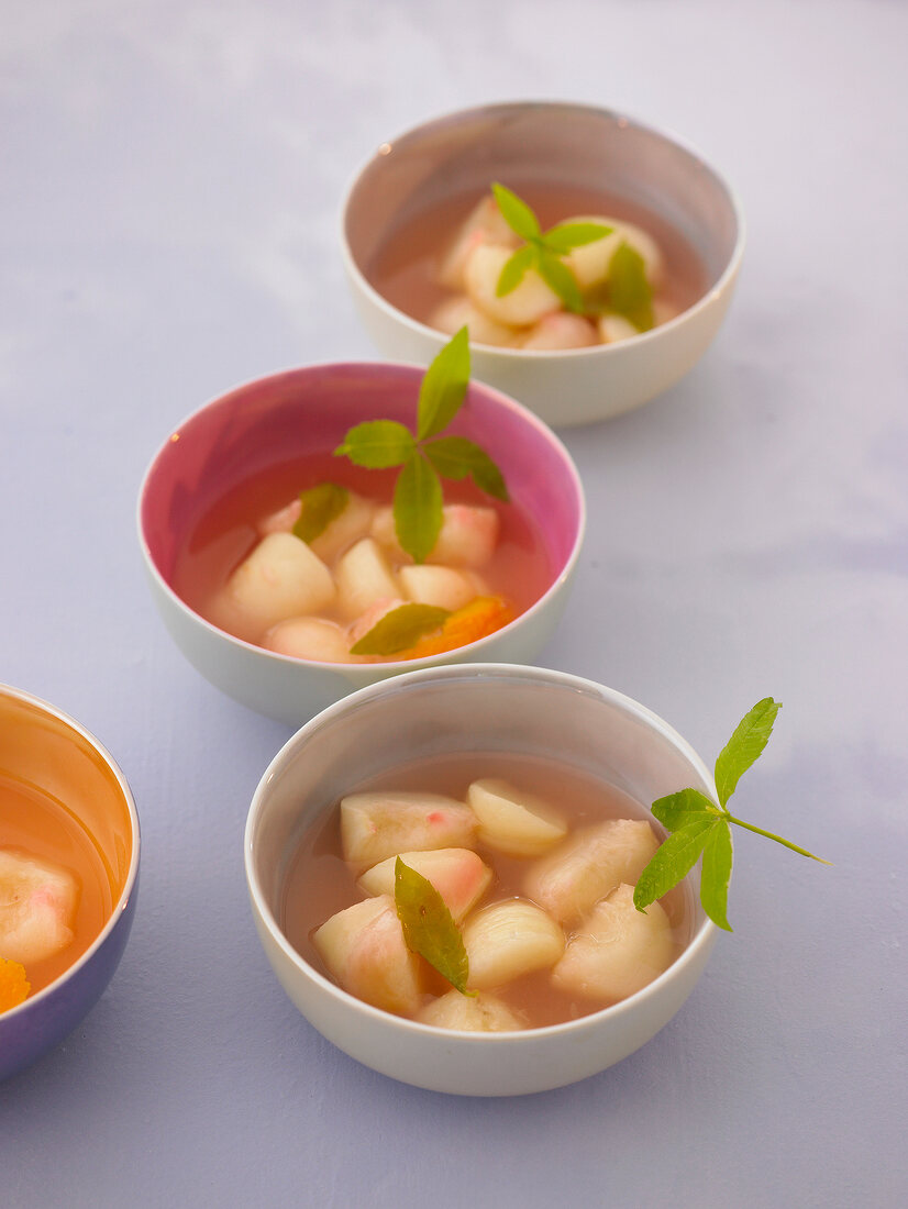 Fours peach dessert with verbena in bowl