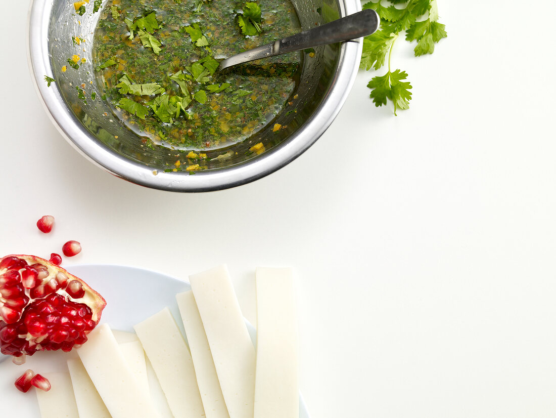 Goat cheese with coriander and pomegranate seeds for preparing carpaccio