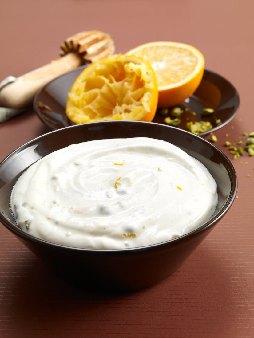Goat cheese and orange mousse with cardamom in bowl