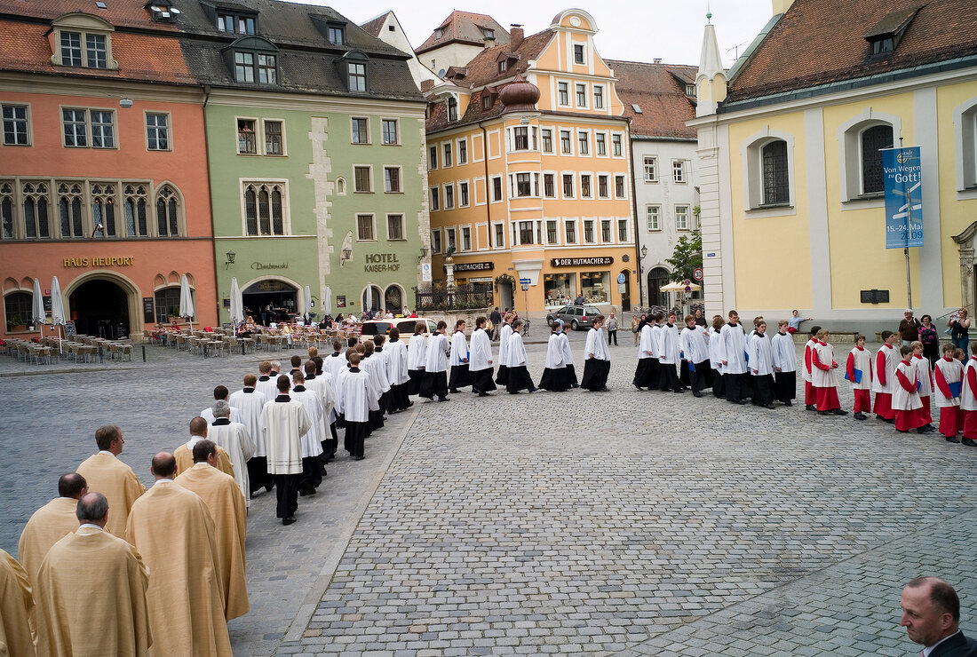 Members of the choir group entering the Regensburg Cathedral Choir to attend concert