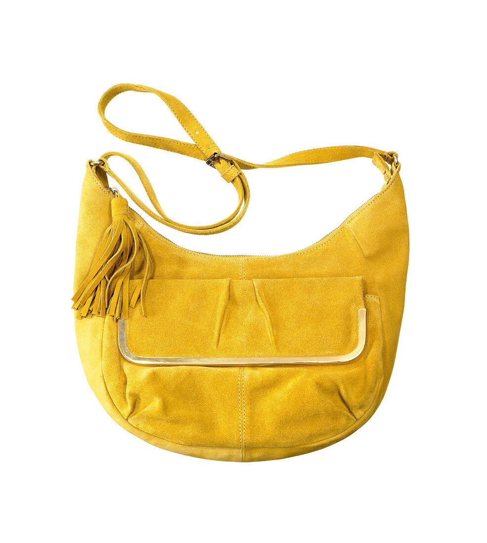 Close-up of yellow suede handbag on white background