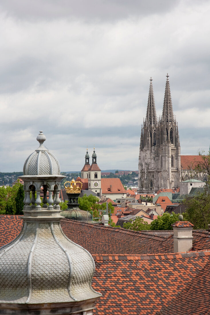 Roofs of houses overlooking exterior of Neupfarr church in Regensburg, Germany