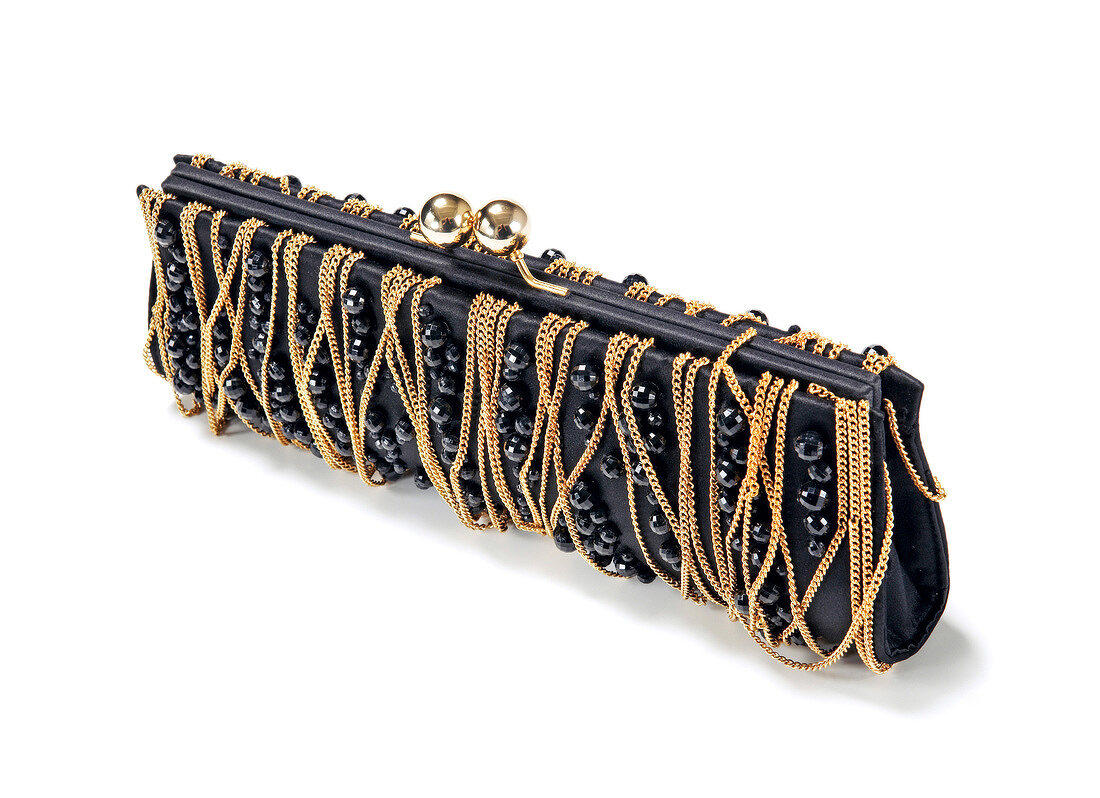Baguette clutch with gold chains on white background