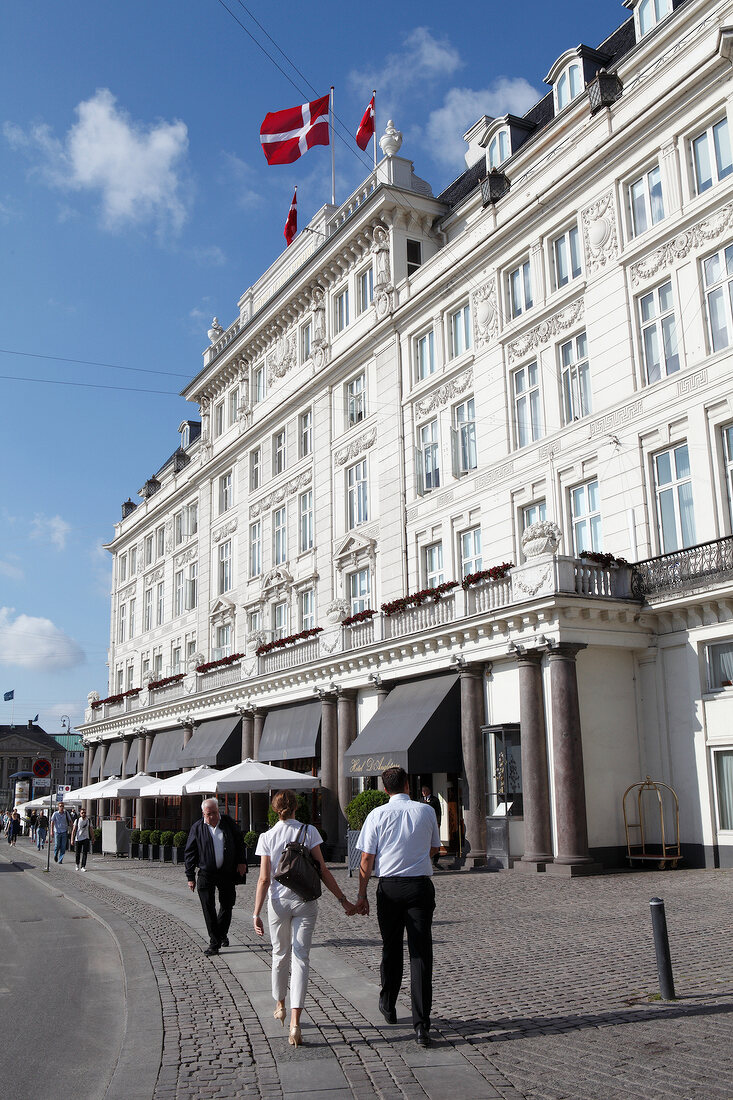 Facade of Hotel D'Angleterre and people walking, Copenhagen, Denmark