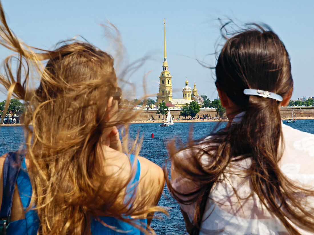 Two women looking at Peter and Paul Fortress in Saint Petersburg, Russia