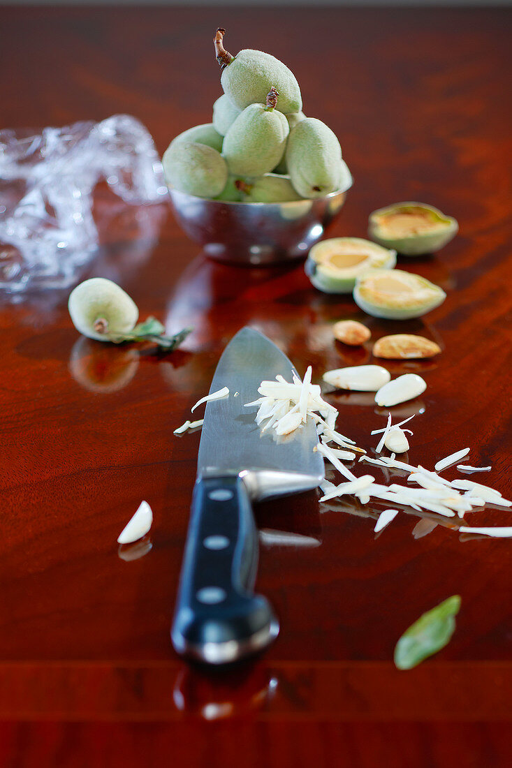 Almonds sliced thinly with knife for preparation of foie gras